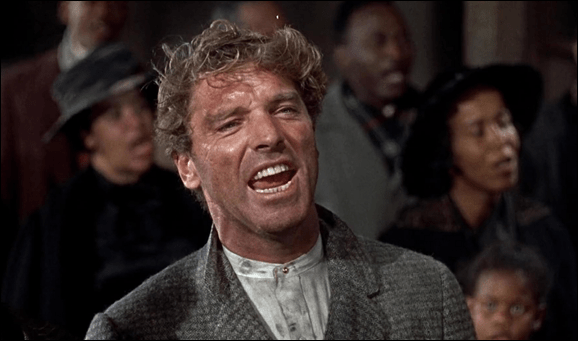 Elmer Gantry canta el himno en la iglesia de los negros